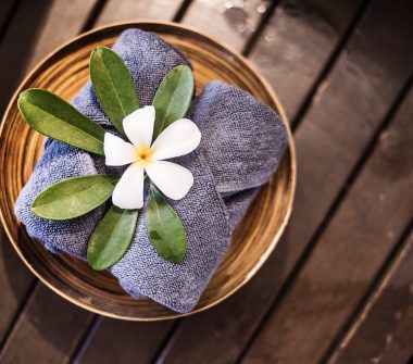 Welcome towels decorated with plumeria flowers