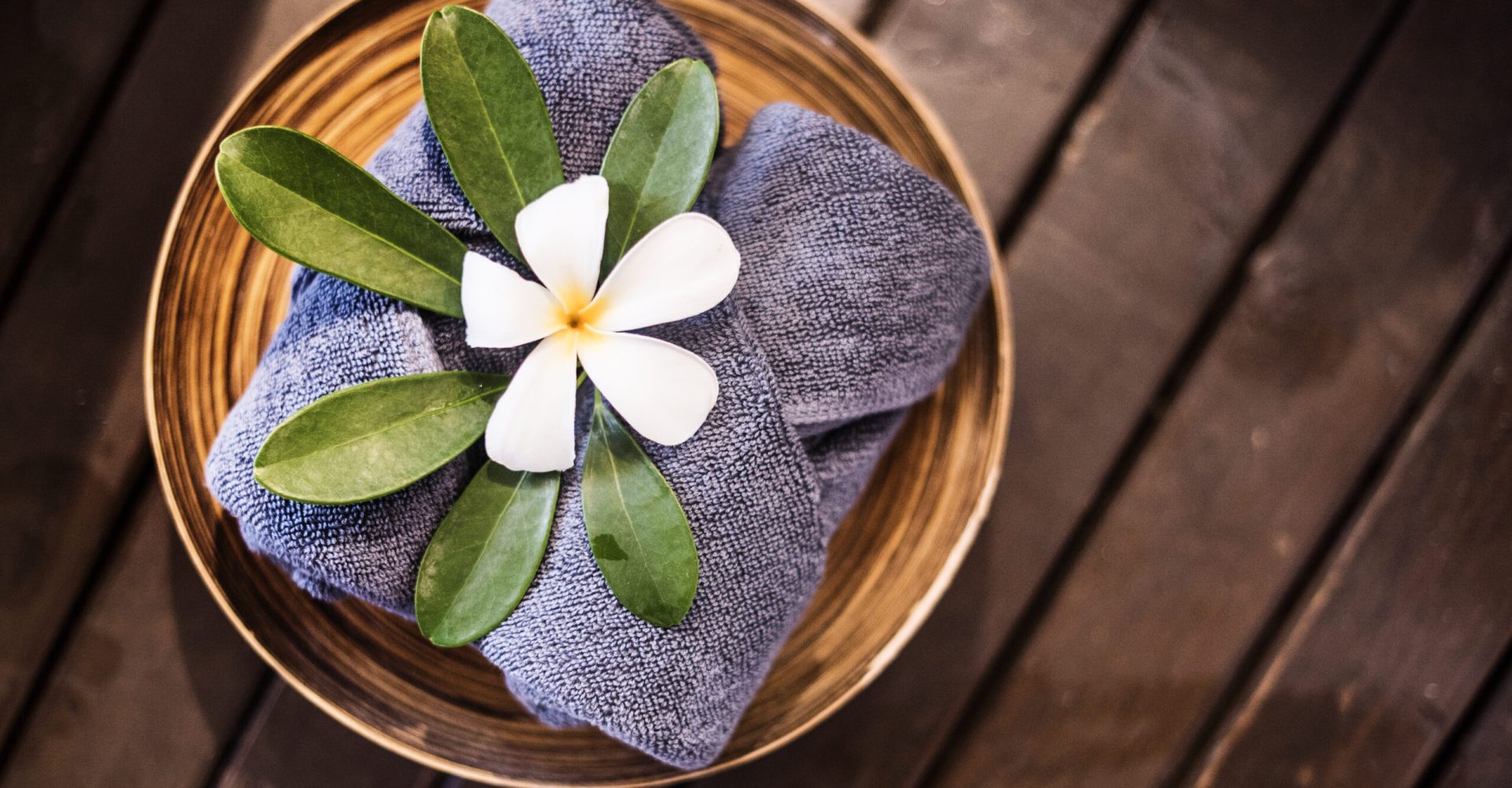 Welcome towels decorated with plumeria flowers